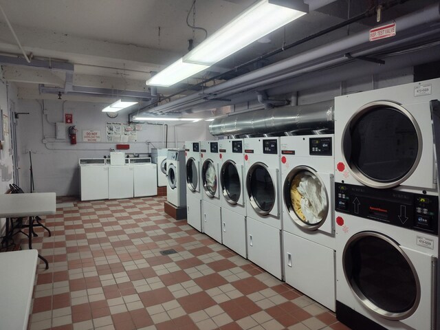 67-66 108th St Unit B64, Forest Hills, NY 11375 - community laundry room with stacked washer / dryer, light floors, and separate washer and dryer