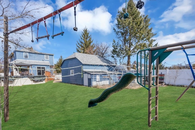 view of yard with playground community and fence