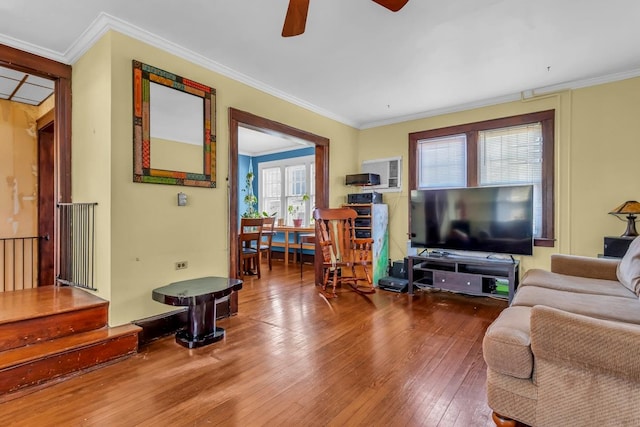 living room featuring ceiling fan, crown molding, and hardwood / wood-style flooring