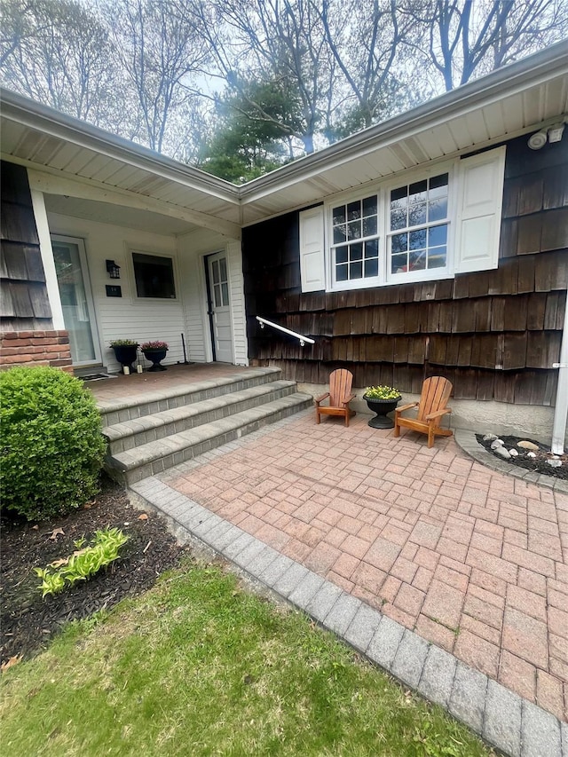 exterior space with a porch and a patio