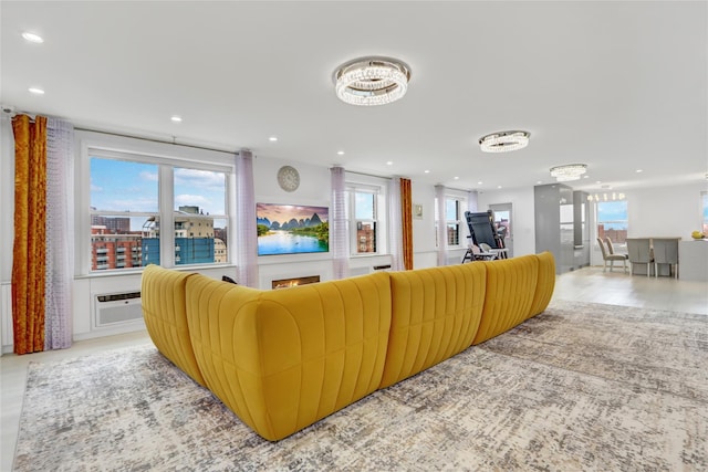 living room featuring a healthy amount of sunlight, recessed lighting, and a chandelier