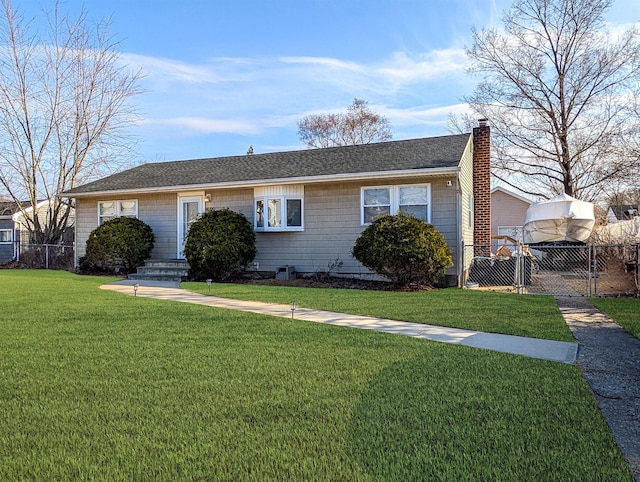 view of front of home with a front yard, a gate, fence, and a chimney