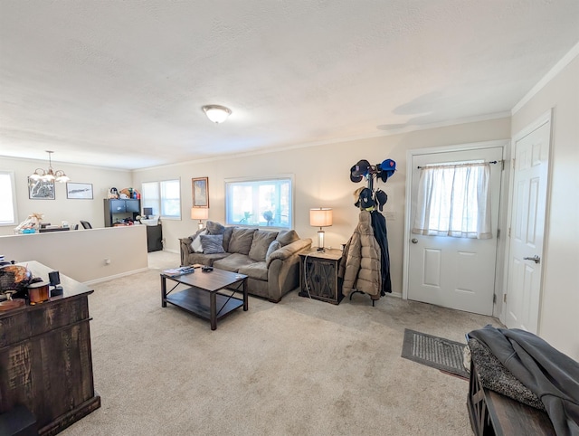 living area with light carpet, a textured ceiling, crown molding, and an inviting chandelier