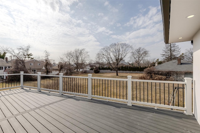 wooden terrace with a residential view