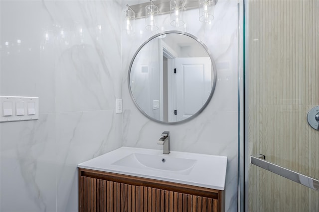 bathroom with tile walls and vanity