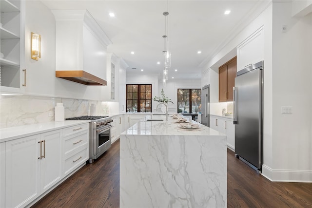 133 Spring Rd Unit 8, Huntington, NY 11743 - kitchen with ornamental molding, light stone counters, dark wood-style floors, high end appliances, and a sink