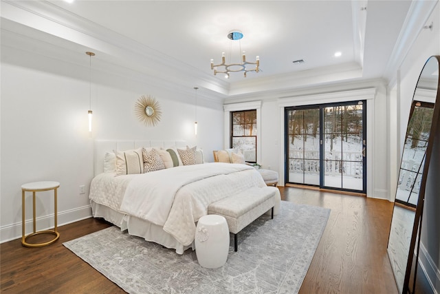 133 Spring Rd Unit 8, Huntington, NY 11743 - bedroom featuring a raised ceiling, wood finished floors, ornamental molding, and access to outside