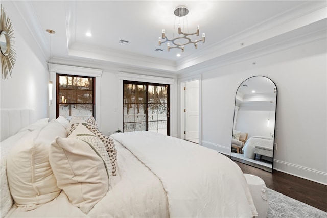 133 Spring Rd Unit 8, Huntington, NY 11743 - bedroom with visible vents, crown molding, a tray ceiling, an inviting chandelier, and wood finished floors