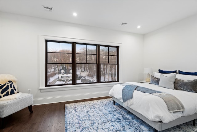 133 Spring Rd Unit 8, Huntington, NY 11743 - bedroom featuring recessed lighting, visible vents, baseboards, and wood finished floors