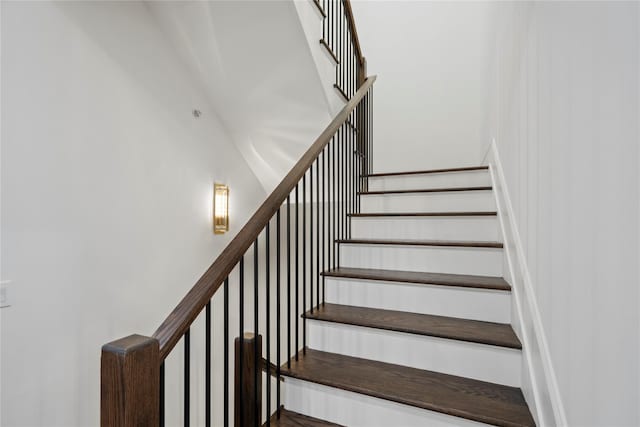 133 Spring Rd Unit 8, Huntington, NY 11743 - staircase featuring a towering ceiling