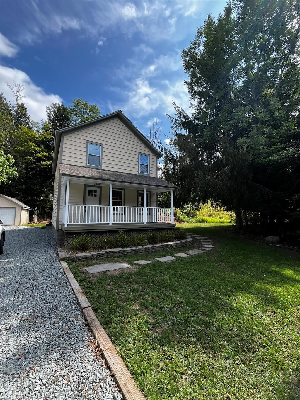 9 Old County Route 149, Livingston Manor, NY 12758 - view of front of house with an outbuilding, a porch, and a front lawn