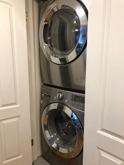 12-31 Robin Ln Unit 52L, Bayside, NY 11360 - laundry area with stacked washer / dryer