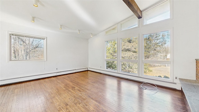empty room with lofted ceiling with beams, a baseboard radiator, baseboard heating, and hardwood / wood-style flooring