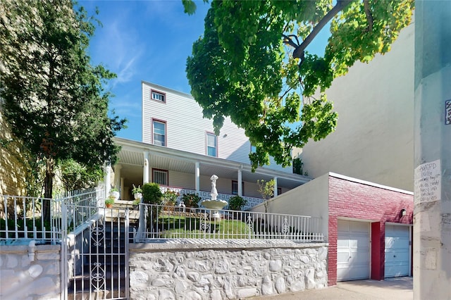 32-25 30th St, Long Island City, NY 11106 - view of front of property featuring covered porch and a fenced front yard