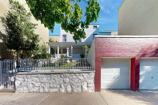 32-25 30th St, Long Island City, NY 11106 - view of front of home featuring fence and a garage