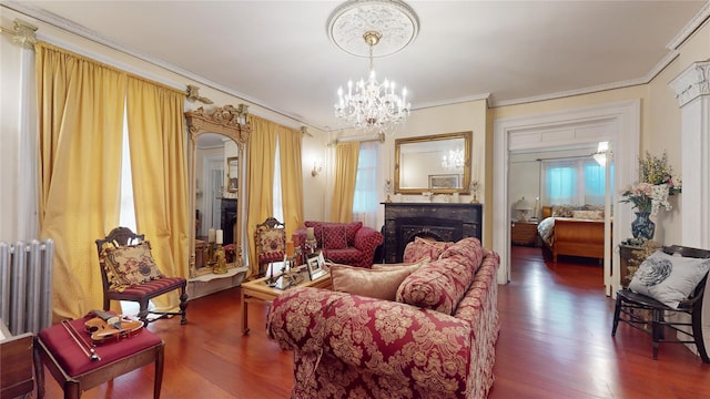 32-25 30th St, Long Island City, NY 11106 - living room featuring wood finished floors, arched walkways, an inviting chandelier, a fireplace, and crown molding