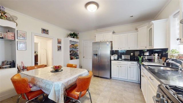32-25 30th St, Long Island City, NY 11106 - kitchen with ornamental molding, a sink, backsplash, white cabinetry, and appliances with stainless steel finishes