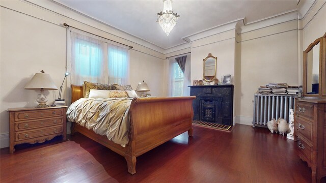32-25 30th St, Long Island City, NY 11106 - bedroom with crown molding, radiator heating unit, and wood finished floors