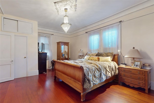 32-25 30th St, Long Island City, NY 11106 - bedroom with a notable chandelier and wood finished floors