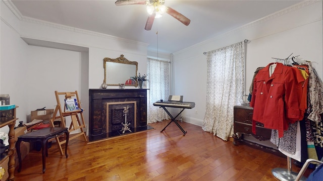 32-25 30th St, Long Island City, NY 11106 - interior space with hardwood / wood-style floors, ornamental molding, a fireplace with raised hearth, and ceiling fan