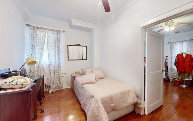 32-25 30th St, Long Island City, NY 11106 - bedroom with hardwood / wood-style floors, multiple windows, and ornamental molding