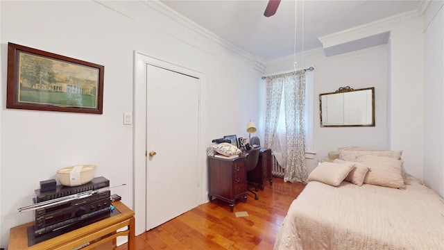 32-25 30th St, Long Island City, NY 11106 - bedroom with ornamental molding, a ceiling fan, and wood finished floors