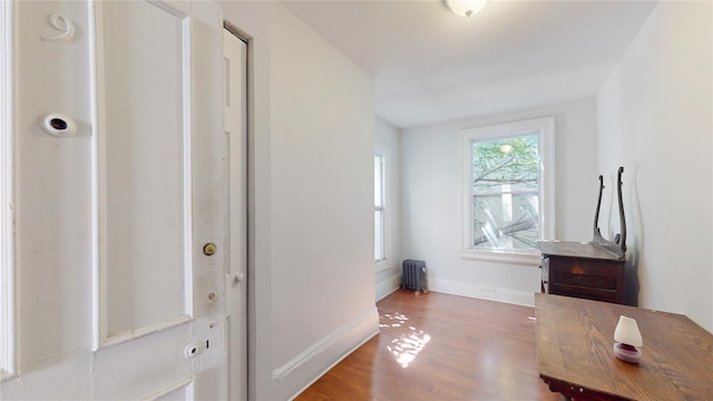 32-25 30th St, Long Island City, NY 11106 - interior space featuring radiator heating unit, baseboards, and wood finished floors