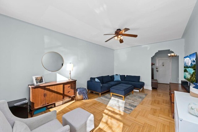 9701 Shore Rd Unit 1O, Brooklyn, NY 11209 - living room featuring ceiling fan and arched walkways