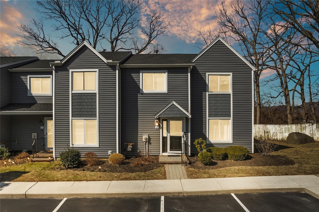 view of front of property featuring uncovered parking