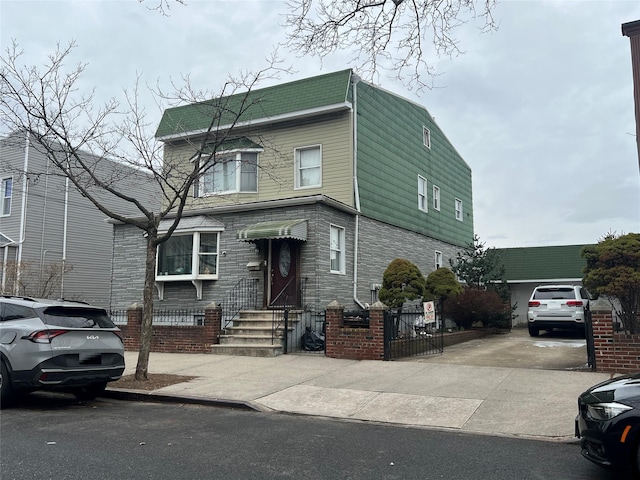 view of front of home with concrete driveway