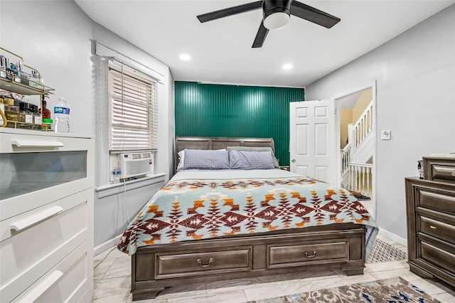 bedroom with cooling unit and a ceiling fan