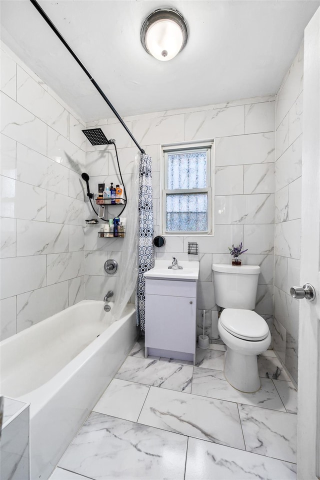 full bath with toilet, shower / bath combo, marble finish floor, tile walls, and a sink