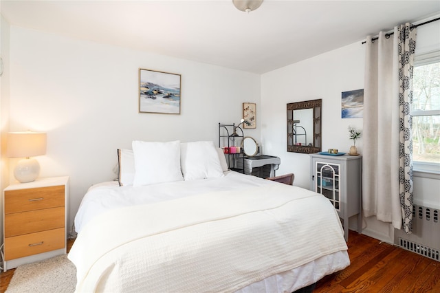 bedroom with wood finished floors