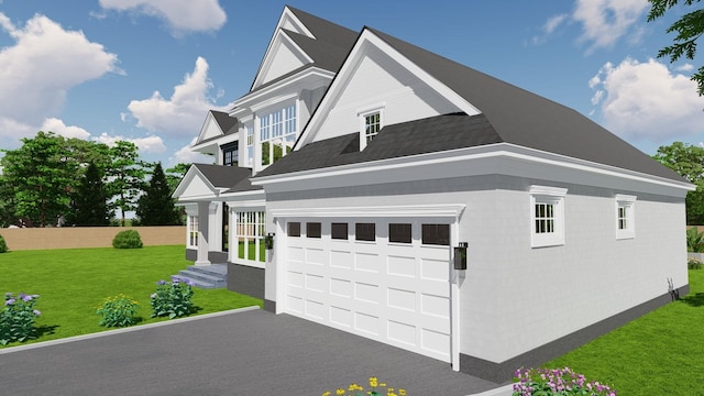 view of front of home with a front lawn, aphalt driveway, and an attached garage