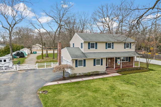 14 Hillside Ave, Saint James, NY 11780 - view of front facade with covered porch, driveway, a gate, a chimney, and a shingled roof
