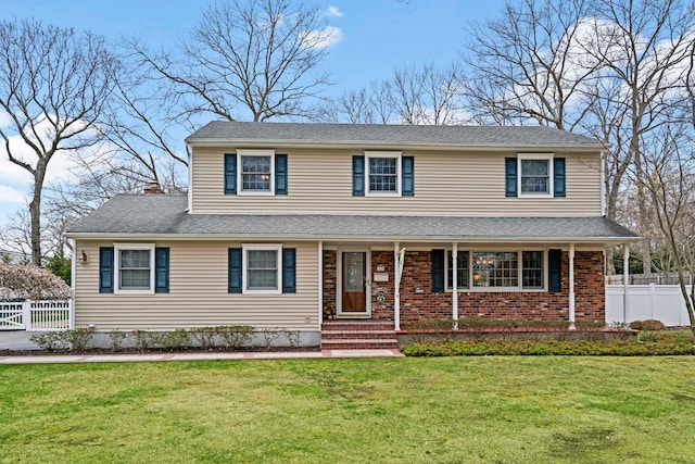 14 Hillside Ave, Saint James, NY 11780 - traditional-style house with a chimney, covered porch, and brick siding