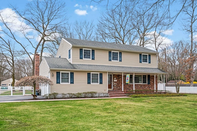 14 Hillside Ave, Saint James, NY 11780 - traditional home featuring covered porch, a chimney, and asphalt driveway