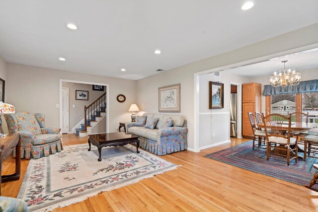 14 Hillside Ave, Saint James, NY 11780 - living area with a chandelier, light wood finished floors, stairs, recessed lighting, and baseboards