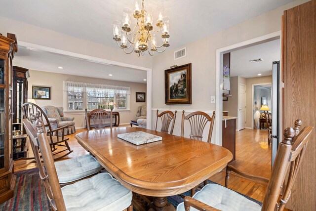 14 Hillside Ave, Saint James, NY 11780 - dining space with light wood-style flooring, a chandelier, and recessed lighting