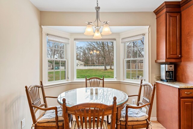 14 Hillside Ave, Saint James, NY 11780 - dining area with a chandelier and light wood-style floors
