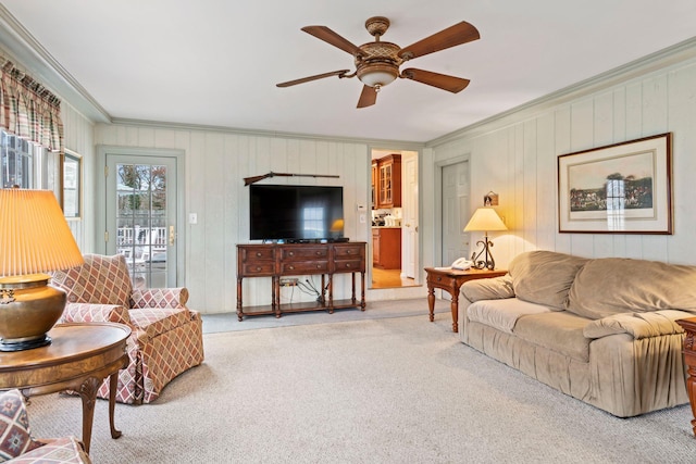14 Hillside Ave, Saint James, NY 11780 - living room with ornamental molding, carpet floors, ceiling fan, and wood walls