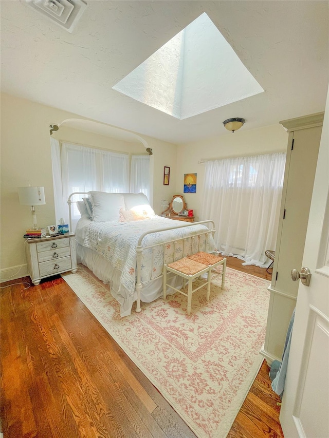 119 Mitchell Ave, Long Beach, NY 11561 - bedroom featuring multiple windows, visible vents, and wood finished floors
