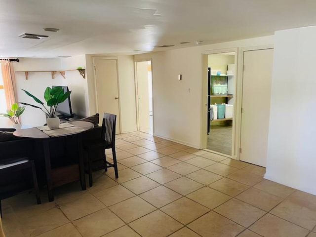 119 Mitchell Ave, Long Beach, NY 11561 - dining room featuring light tile patterned floors and visible vents