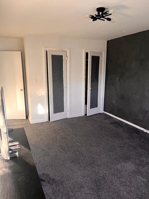 133-25 Blossom Ave, Flushing, NY 11355 - unfurnished bedroom featuring carpet