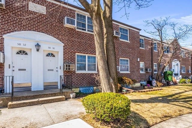 58-30 251st St Unit 2Nd, Little Neck, NY 11362 - entrance to property with brick siding and a lawn