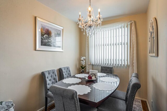 58-30 251st St Unit 2Nd, Little Neck, NY 11362 - dining area with baseboards and a chandelier