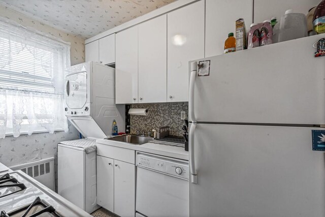 58-30 251st St Unit 2Nd, Little Neck, NY 11362 - kitchen featuring white cabinets, white appliances, light countertops, and a sink