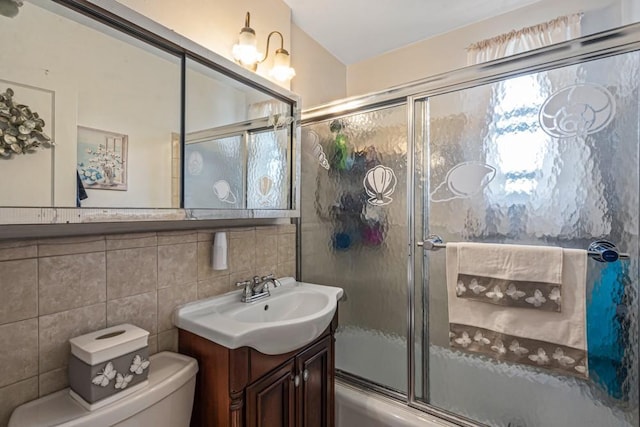 58-30 251st St Unit 2Nd, Little Neck, NY 11362 - full bathroom with vanity, enclosed tub / shower combo, tile walls, toilet, and tasteful backsplash