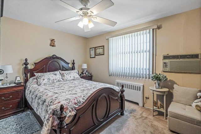 58-30 251st St Unit 2Nd, Little Neck, NY 11362 - bedroom featuring light carpet, a ceiling fan, an AC wall unit, and radiator heating unit