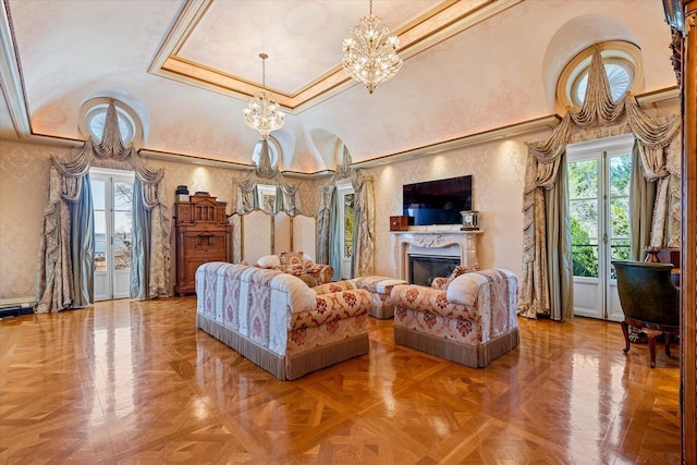 186 Kings Point Rd, Great Neck, NY 11024 - living area featuring a chandelier, french doors, a towering ceiling, ornamental molding, and a fireplace